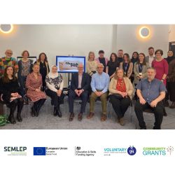 Community Grants celebration event group picture, taken infront of screen which reads 'thank you'